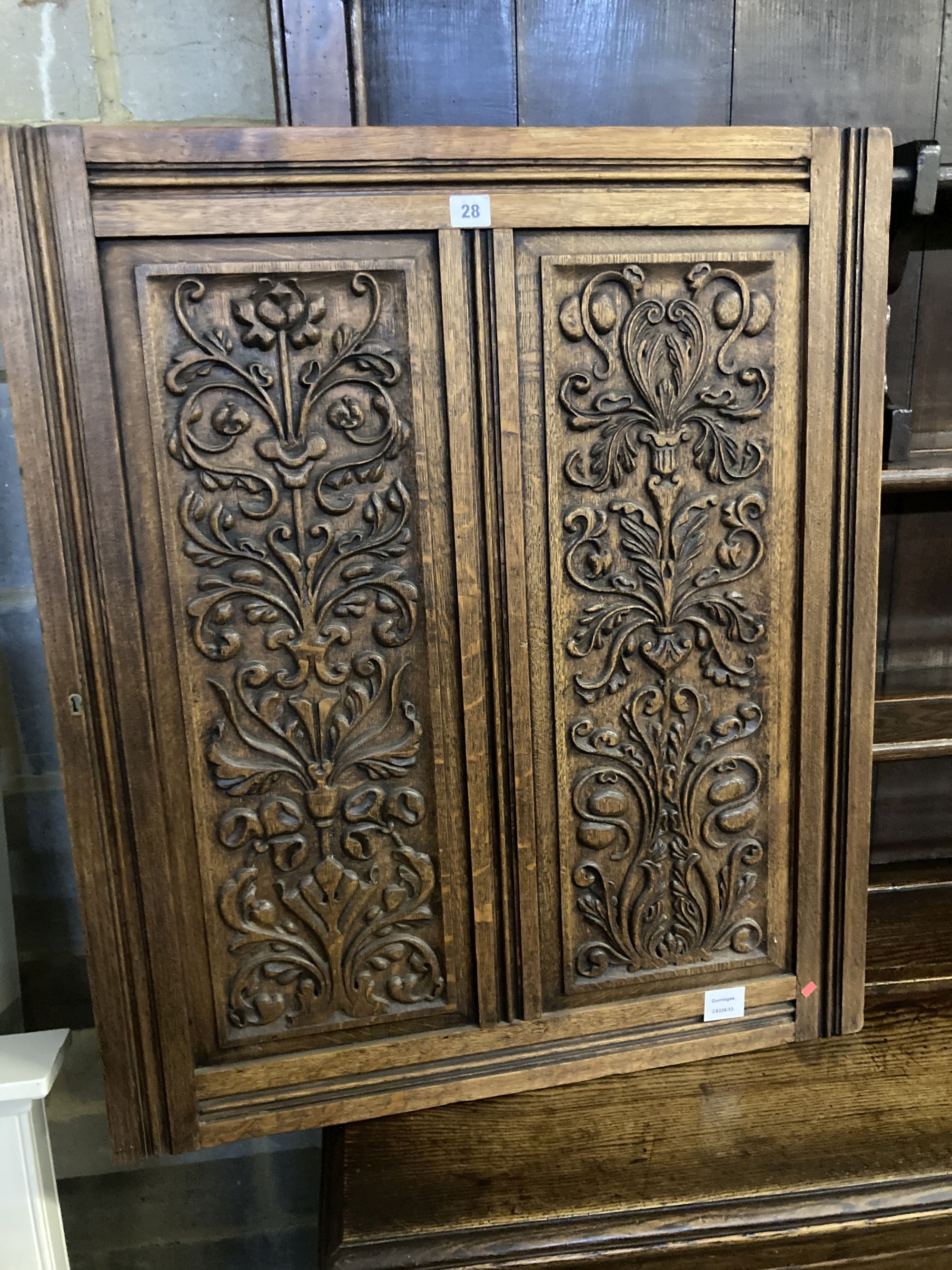 A late 19th century carved oak panel, width 72cm height 84cm